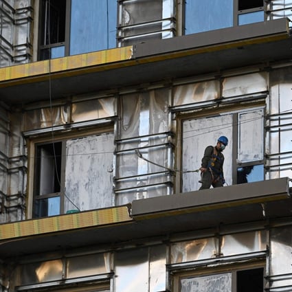 A labourer works at a construction site in Beijing. Photo: AFP