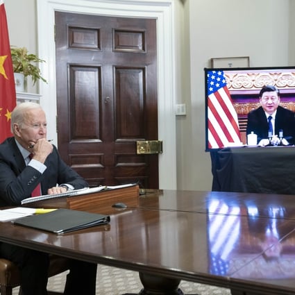 US President Joe Biden, at the White House, listens to counterpart Xi Jinping by video link from Beijing. Photo: Bloomberg