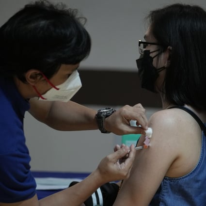 A health worker gets vaccinated against Covid-19 in Quezon City, Philippines. Photo: AP