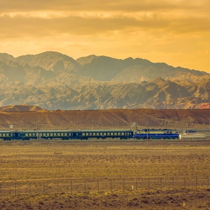 A train runs through the Gobi Desert and Qilian mountains in northwest China’s Gansu province. Photo: Handout