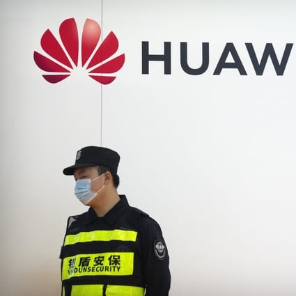A security guard stands near a booth for Chinese technology firm Huawei at the PT Expo in Beijing, Tuesday, Sept. 28, 2021. The annual expo showcases Chinese and foreign telecommunications firms. Photo: AP