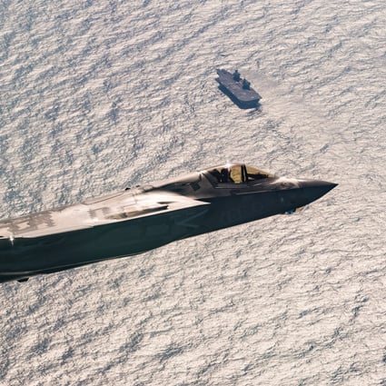 A F-35 fighter jet flying above HMS Queen Elizabeth in 2018. File photo: Lockheed Martin