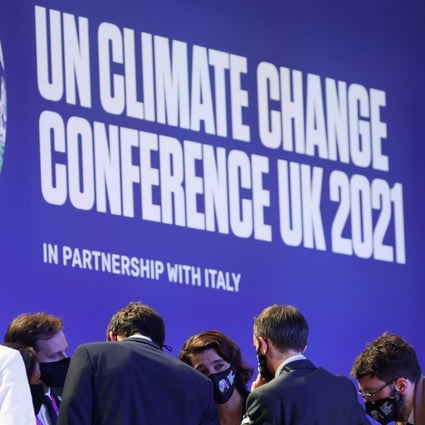 Delegates confer during COP26 meetings in Glasgow on November 13. Photo: Reuters