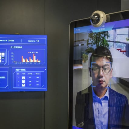 Xu Li, chief executive officer of SenseTime Group, is identified by the company's facial recognition system on a screen at the company’s showroom in Beijing on June 15, 2018. Photo: Bloomberg