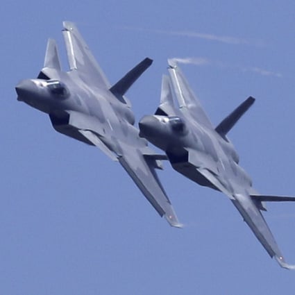 A PLA pilot has speculated on Chinese state media about a possible pairing of the J-20 stealth fighter with drones to improve the aircraft’s surveillance and warfare abilities. Photo: AP