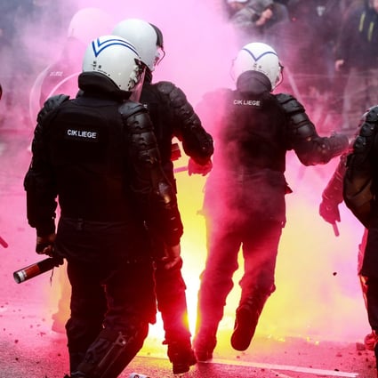 Riot police clash with protesters in Brussels, Belgium. Photo: EPA-EFE