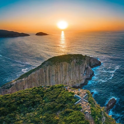 Sunset over Hong Kong’s triangular Po Pin Chau sea stack – separated from the Fa Shan headland by sea erosion – close to High Island Geo Trail in eastern Sai Kung Peninsula.