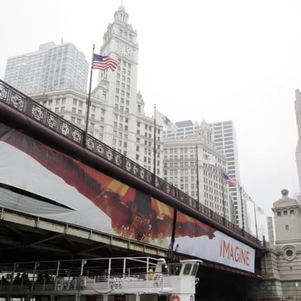Tribune Tower is seen on the right of the Michigan Avenue bridge in downtown Chicago. Tribune Media has hired a real estate investment banker to explore the sale of Tribune Tower. Photo: AP