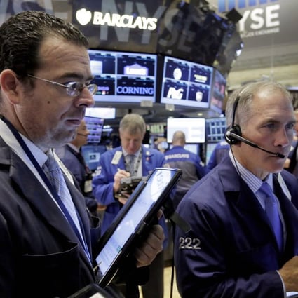 Traders on the floor of the New York Stock Exchange as earnings season kicks off. Photo: AP