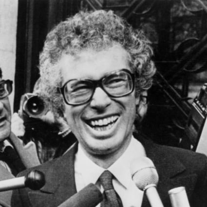 Ken Taylor, Canadian Ambassador to Iran, jokes with reporters outside the Canadian Embassy in Paris in 1980. Photo: AP