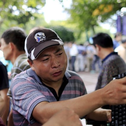 A street stock salon is fixed to the back of an electric bicycle in central Shanghai. Photo: Reuters