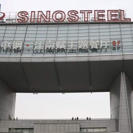 Workers walk past Sinosteel's headquarters in Beijing. Photo: Reuters