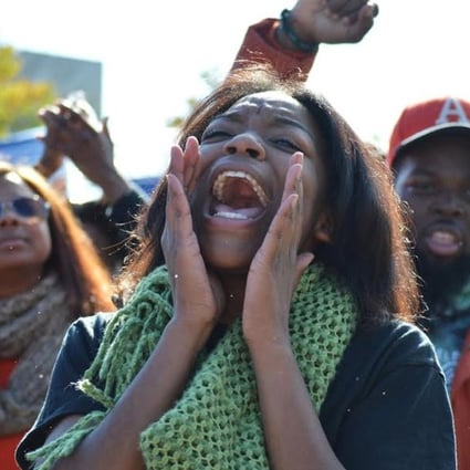 A student chants after the University of Missouri's president Tim Wolfe announced his resignation on Monday. Photo: Reuters