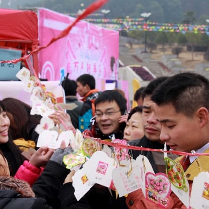 Dating is different in China: Singles read personal information about other singles at a blind date event in Yichun city, 2012. Photo: SCMP Pictures