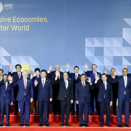 Leaders pose for a group photo at the Asia-Pacific Economic Cooperation summit in Manila on Thursday. Photo: EPA