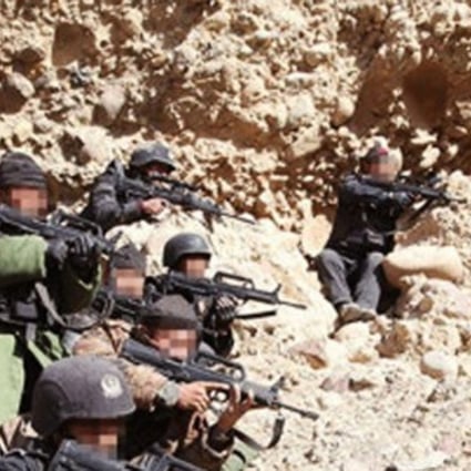 Chinese paramilitary forces taking part in the manhunt for the militants who attacked a mine in Xinjiang two months ago. Photo: SCMP Pictures