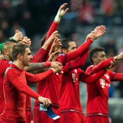 Bayern Munich's captain Philipp Lahm (front) and his teammates celebrate the win. Photo: AFP