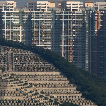 Graves cover a hillside in front of apartment buildings in Hong Kong,the cramped southern Chinese city of 7.2 million peopel. Photo: AP