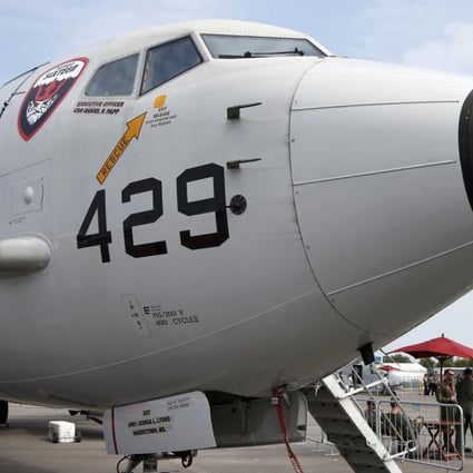 A US Navy Boeing Poseidon P8 aircraft sits on display at the 2014 Singapore Airshow . Photo: Reuters
