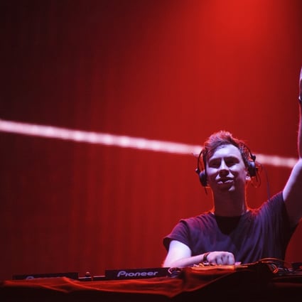 Hardwell points to the heavens as he spins another disc while bodies below writhe to the beat.