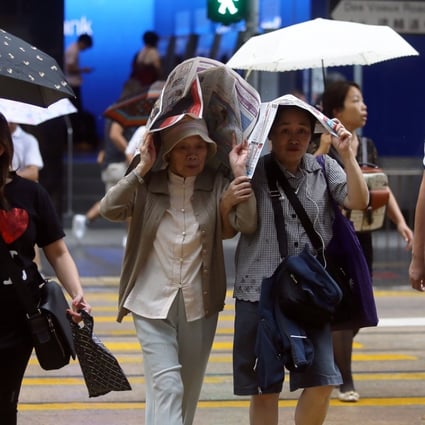The rain caught some shoppers by surprise. Photo: SCMP Pictures