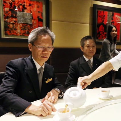 Yung Kee wine manager Derrick Chung (left), sales manager Peter Sham Wah and chef Fung Ho-tong have tea at the restaurant. Photo: Felix Wong  