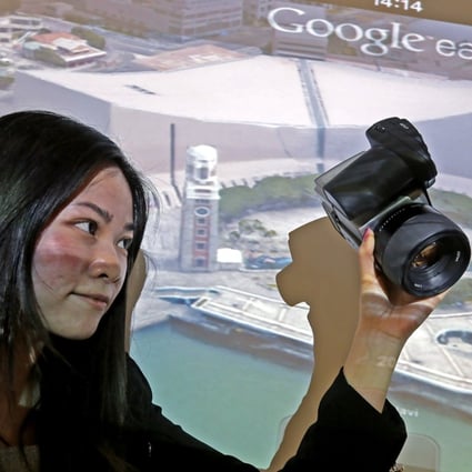 Cindy Law, production support officer of DIMAP HK PTY ltd, speaks about Google’s 3D mapping of Hong Kong. Photo: Dickson Lee
