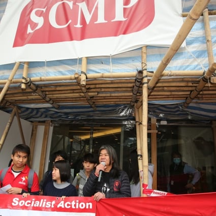 Members of Socialist Action and lawmaker Leung Kwok-hung ‘Long Hair’ (right) picket SCMP’s Leighton Road office against Alibaba’s purchase of the Post. Photo: Edward Wong