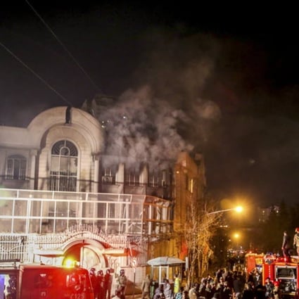 Smoke rises as Iranian protesters, upset over the execution of Shiite cleric Nimr al-Nimr in Saudi Arabia, set fire to the Saudi embassy in Tehran, Iran. Photo: AFP