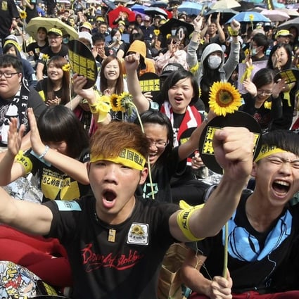 Demonstrators taking part in the Sunflower movement shout slogans in front of the Presidential Office in Taipei in 2014. Young Taiwanese are much more politically active than their forbears. Photo: Reuters