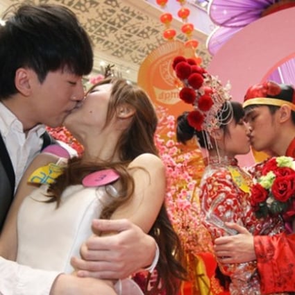 A file picture of couples taking part in a kissing contest last year in Hong Kong. The poll was conducted among 80,000 people around China. Photo: SCMP Pictures
