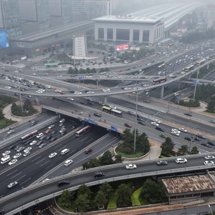 A file photo showing vehicles making their way through Xizhimenin bridge in Beijing. Photo: AFP