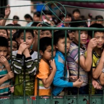 A file picture of children at a school in the Guangxi region of southern China. Poorer areas like Guangxi and Guizhou have many “left-behind children”, the offspring of migrant workers based away from home. Photo: AFP