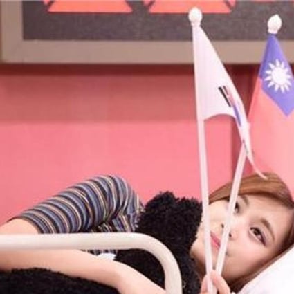 Youtube capture of Chou Tzu-Yyu waving a Taiwan flag.