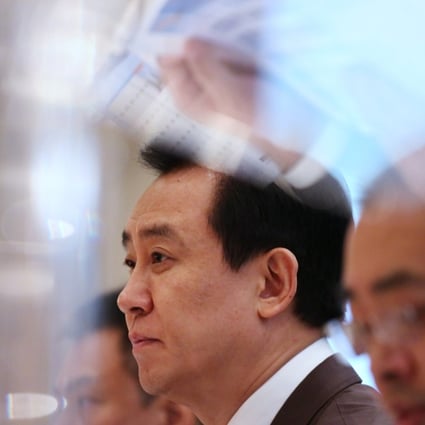 Professor Hui Ka-yan (centre), Chairman of the Board, Evergrande Real Estate Group, attends the Company's interim results announcement 2015 press conference at the Four Seasons Hotel Hong Kong, Central on August 21. Photo: SCMP