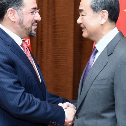 Chinese Foreign Minister Wang Yi (right) meets his Afghan counterpart Salahuddin Rabbani. Photo: Xinhua