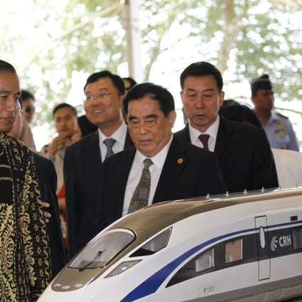 Indonesian President Joko Widodo with Sheng Guangzu, general manager of China Railway Corp, at the groundbreaking ceremony for the Jakarta-Bandung fast-train railway line in Indonesia last week. Construction for the project has since been stalled. Photo: Reuters