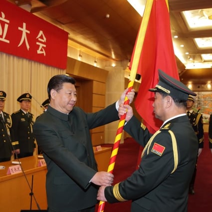 Chinese President Xi Jinping (left, front) confers a military flag to Commander Song Puxuan and Political Commissar Chu Yimin of the Northern Theatre Command on Monday. Photo: Xinhua