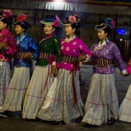 Members of China’s Mosuo ethnic minority, considered one of the last matriarchal societies in the world, dance for tourists in this file photo. Photo: SCMP Pictures
