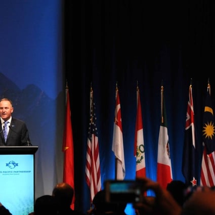 New Zealand Prime Minister John Key addresses officials from the 12 signatory nations in Auckland on Thursday. Photo: Xinhua