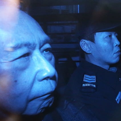 Rafael Hui escorted by Correctional Services officers. Photo: Sam Tsang.