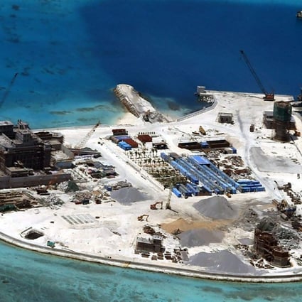 Aerial view of construction at Mabini (Johnson) Reef by China, in the disputed Spratley Islands, in the south China Sea. China deployed two batteries of sophisticated surface-to-air missile launchers to a disputed island in the South China Sea yesterday. Photo: EPA