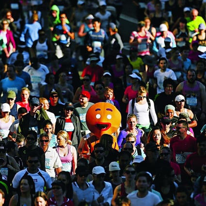 A participant dressed as a gingerbread man races in the annual ‘City 2 Surf Fun Run’ in Sydney. The uphill battle for young aspiring home owners is most apparent in Sydney where the median home costs 12.2 times the median annual pretax household income. Photo: Reuters