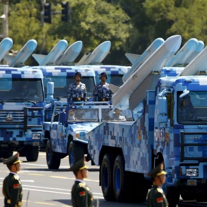Marine corps vehicles carry ship-to-air missiles during the huge military parade in the centre of Beijing last September to mark the 70th anniversary of the end of the second world war. Photo: Reuters