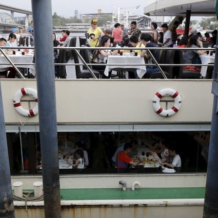 Chinese tourists dine onboard a boat at a pier at Chao Phraya River in Bangkok February 16, 2016. The perpetrators of last year's deadly explosion at a Bangkok shrine originally chose a pier packed with Chinese tourists as their primary target and had amassed enough chemicals to make 10 equally powerful bombs, the chief of Thailand's police bomb squad told Reuters. Picture taken February 16, 2016. REUTERS/Jorge Silva