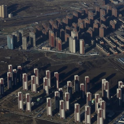 Apartments are seen from a plane on the outskirts of Beijing. Corporates making speculative investments in real estate is not a new phenomenon. Photo: Reuters