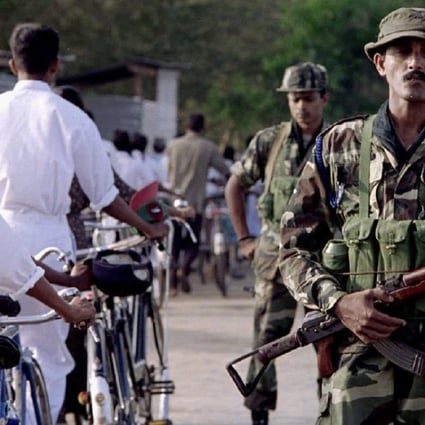 Sri Lankan troops man a checkpoint near the eastern town of Batticaloa during the lengthy civil war. Photo: Reuters