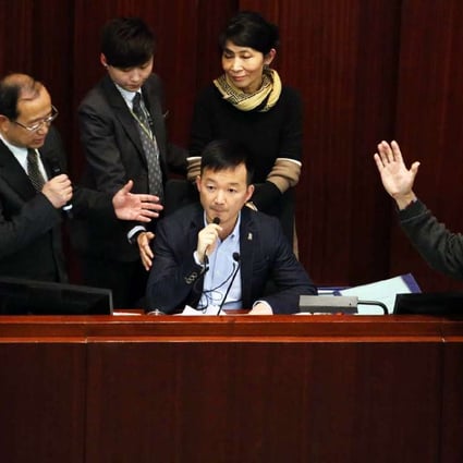 Lawmaker Raymond Chan Chi-chuen taking over the finance committee’s seat in protest. Photo: Felix Wong