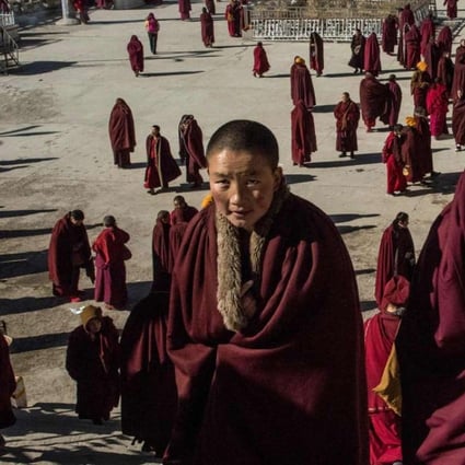 Buddhist nuns leave the monastery after praying at the Larung Gar Buddhist Institute in Sertar county (known as Seda in Chinese) in the remote Garze Tibetan Autonomous Prefecture in China’s Sichuan province. Photos: AFP
