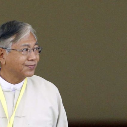 Newly elected president of Myanmar Htin Kyaw leaves parliament after he was voted in. Photo: EPA